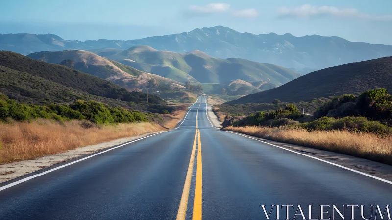 Two-lane highway stretches straight through rolling green hills