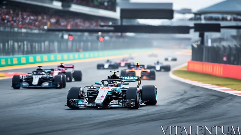 Formula 1 race cars accelerate down fast grand prix straight.