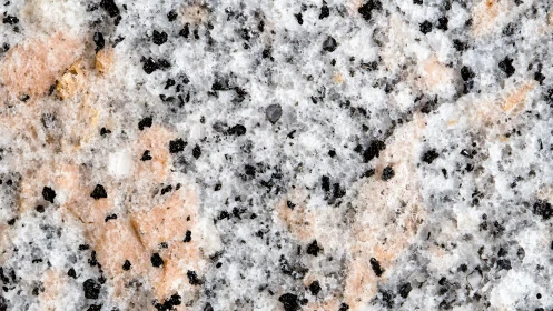 Granite surface shows speckled pink, white and black minerals