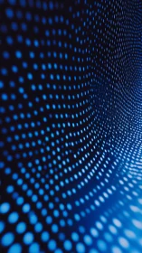 Blue dot matrix forms curved grid on dark abstract surface