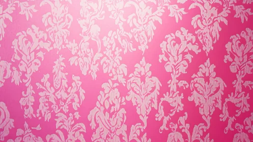 Pink wall shows repeating white damask pattern in gradient light