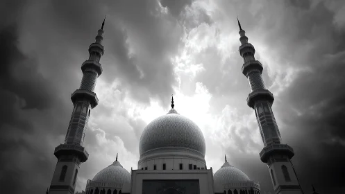 Mosque domes and twin minarets stand under overcast sky