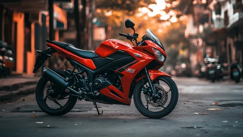 Red sport motorcycle stands poised on a quiet urban street.