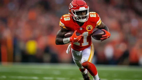Kansas City Chiefs wide receiver running with football.