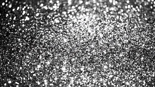 Silver glitter granules form a dense reflective surface