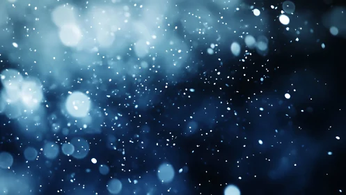 Soft blue snowflakes drift through a dreamy winter night