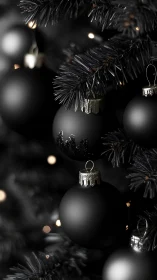 Monochrome ornaments hang on artificial tree branches in focus
