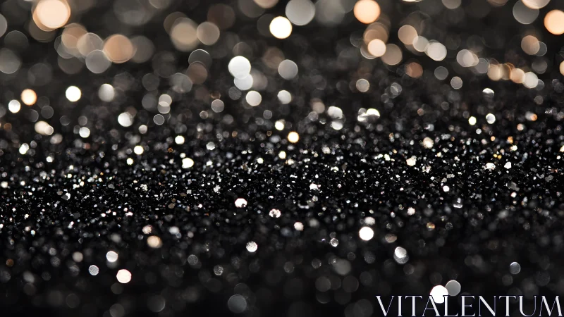 Abstract macro photo of black glitter surface with golden bokeh lights.