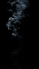 Vertical column of pale smoke on solid black background.
