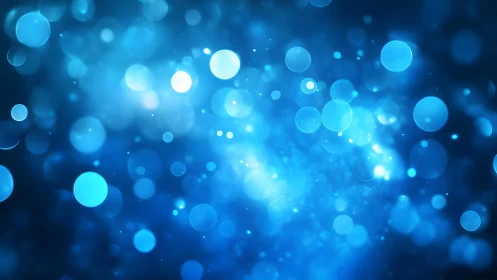 Abstract blue bokeh lights background with glowing circles effect.