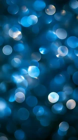 Soft blue bokeh lights drift gently in a dreamy glow