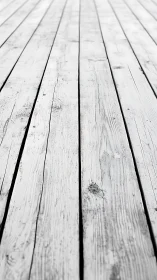Weathered white planks stretch into a soft, hazy distance.