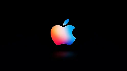 Glowing multicolor apple logo against soft black night sky.