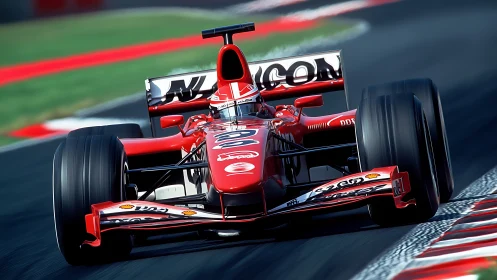 Red Formula race car speeding through track corner.