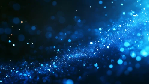 Blue bokeh particle stream on dark abstract background.
