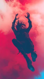 Silhouetted figure suspended against high-contrast red sky