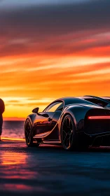 Black supercar parked on wet coast at vivid sunset.