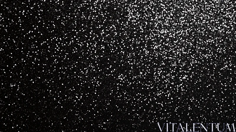 Silver glitter dust sparkles across deep black surface.