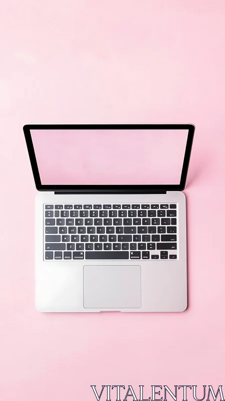 Laptop lounges confidently on a sugar-pink creative stage