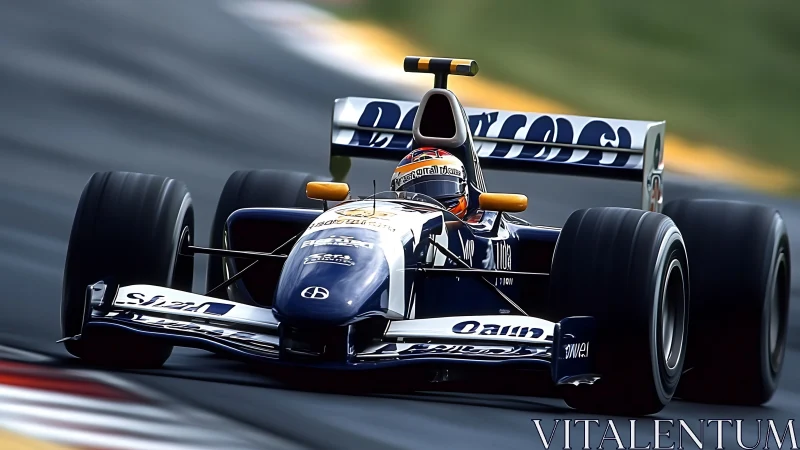 Open-wheel Formula race car on asphalt circuit cornering.