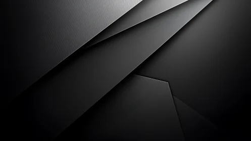 Soft black geometry folding into calm abstract shadows.