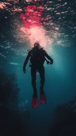 Scuba diver silhouette ascending through colored surface light