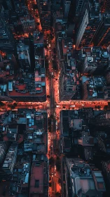 Nocturnal aerial grid of dense city intersection in blue red