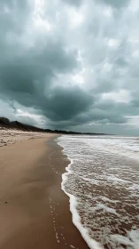 Stormy shoreline captures moody waves under brooding skies