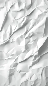 Crumpled white paper peaks sculpted into soft abstract terrain.