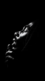 Soft spotlight cradles a soulful singer lost in song