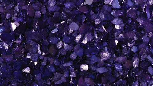 Deep purple crystal chips with glittering reflective texture.