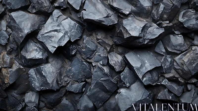 Dark fractured rock wall with sharp angular slate textures.