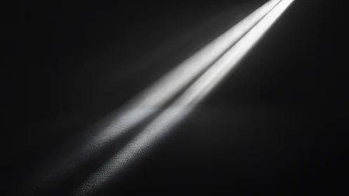 Oblique twin light beams cutting through textured darkness.