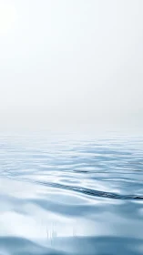 Calm horizontal water surface under pale overcast sky.
