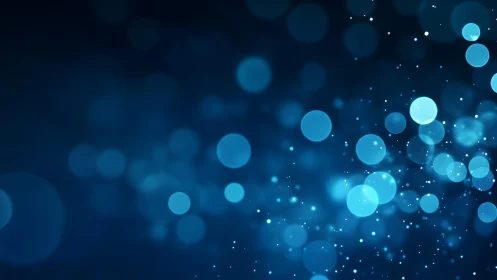 Abstract blue bokeh lights background with soft glowing circles.