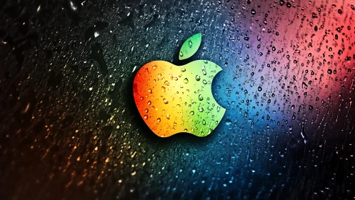 Iridescent apple emblem contrasts against wet glass surface