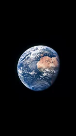 Solitary blue planet drifts like a painted marble in night