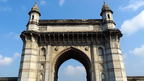 Stone gateway crowns sky with carved grandeur and quiet power.