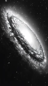 Monochrome spiral galaxy core with dense stellar halo glow.