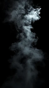 Soft white smoke curls upward in a graceful darkened space