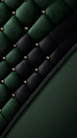 Green and black quilted leather surface shows studded detail