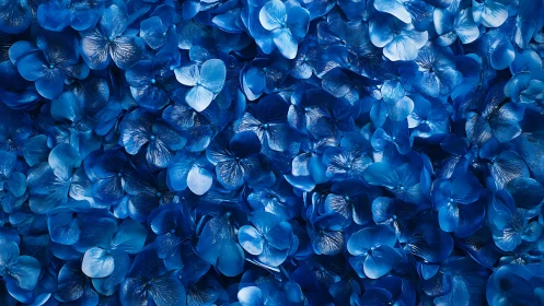 Luminous blue petals cascade densely across frame.