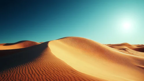 Sunlit desert dunes with sculpted ridges and cyan sky.