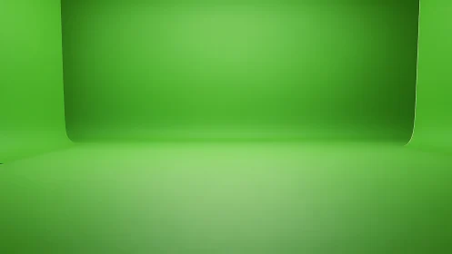 Green chroma key studio backdrop with seamless curved sweep.
