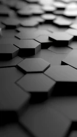 Softly lit black hexagons forming a calm modern surface.