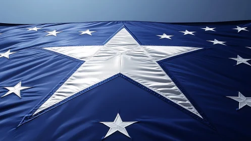 Metallic star emblem across rippling deep blue banner surface.