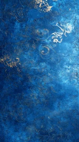 Textured cobalt blue surface with embossed golden filigree