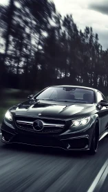 High-gloss black Mercedes coupe captured in dynamic motion blur
