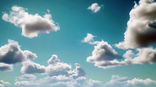 Soft afternoon clouds drifting across a calm blue sky.