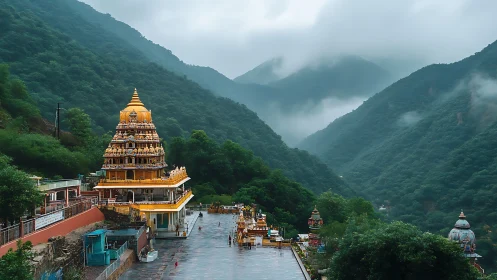 Hill temple complex in lush green misty mountain valley.